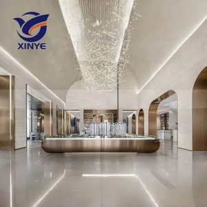 Bespoke PVD gold stainless steel Reception Desk and door jamb with luxurious brushed finish for custom interior door frames and high-end architectural entrance trim