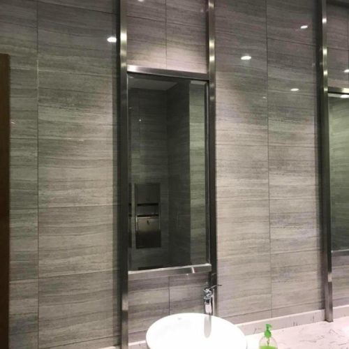 Hospitality stainless steel decoration contractor Xinye Metal specializing in custom gold and black stainless steel architectural elements for luxury hotels, restaurants, resorts, and commercial hospitality interiors worldwide