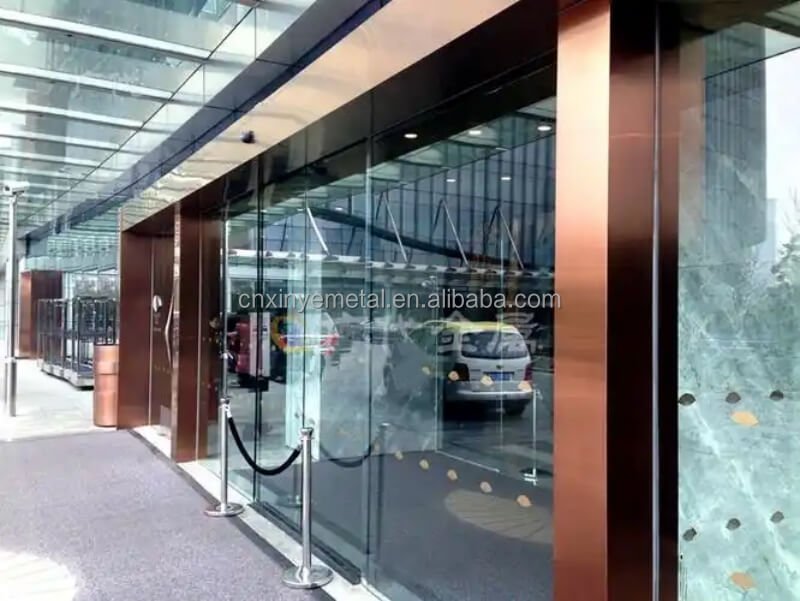 PVD gold stainless steel entrance frame with luxurious brushed finish for modern building entry doors and main entrance doorway trim