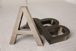 Etched stainless steel sign for business branding