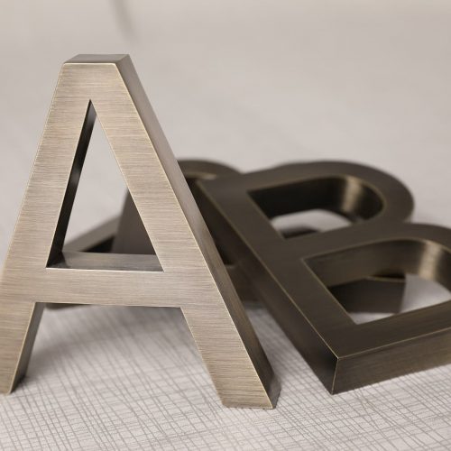 Etched stainless steel sign for business branding