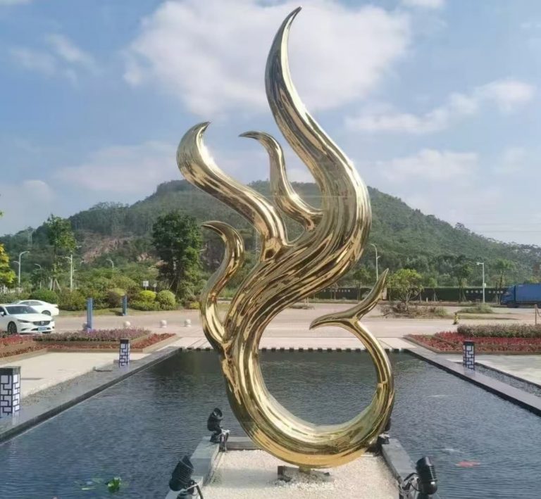 Minimalist stainless steel fountain feature with smooth arcs and gleaming surface