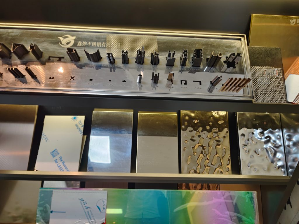 Vibrant color-coated stainless steel samples from XinYe Metal, showcasing a rainbow of finish options for decorative and architectural applications.