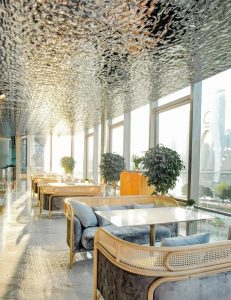 High-gloss water ripple stainless steel plate creating dynamic light distortions