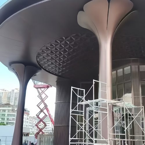 Custom grand entrance column for luxury hotel by XinYe Metal, stainless steel finish.