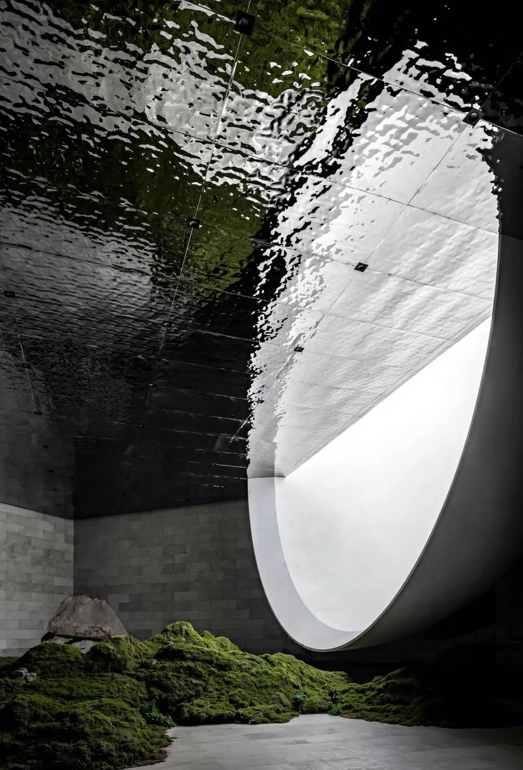 Moon-lake-inspired art installation with water ripple stainless steel panels, shimmering light reflections, shadow play, and tranquil metallic atmosphere.