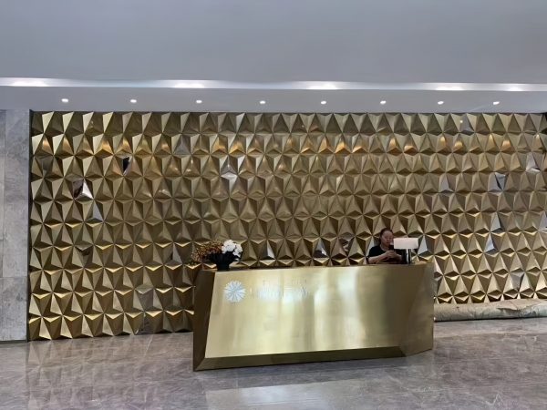 Custom gold stainless steel metal feature wall for hotel lobby by XinYe Metal.