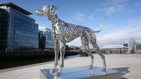 Large scale stainless steel dog sculpture custom fabricated for commercial plaza