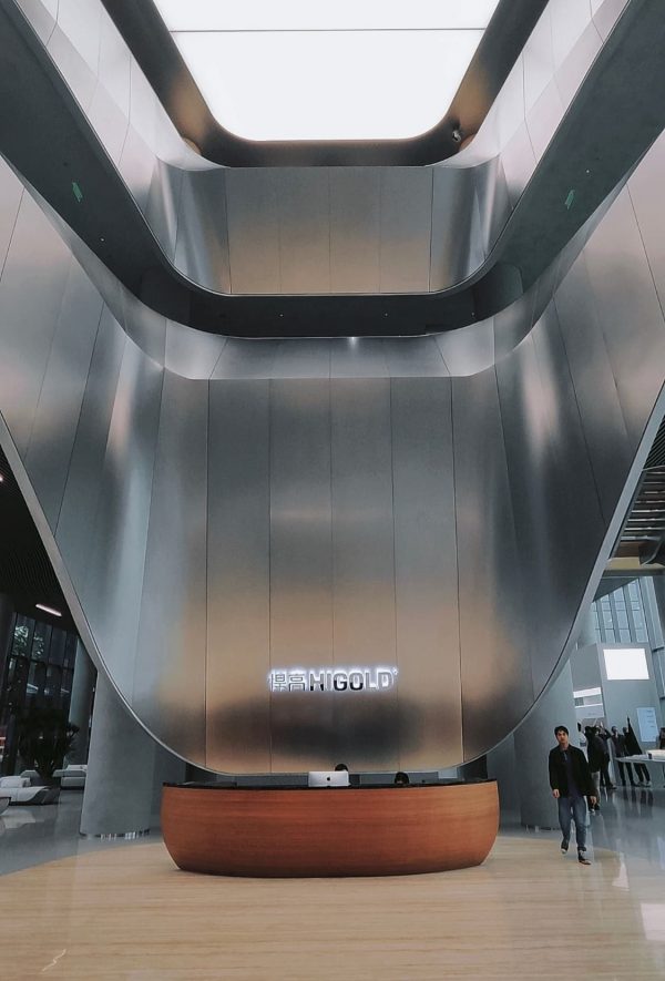 Giant metal curtain wall for office building entrance by XinYe Metal, impressive stainless steel facade.