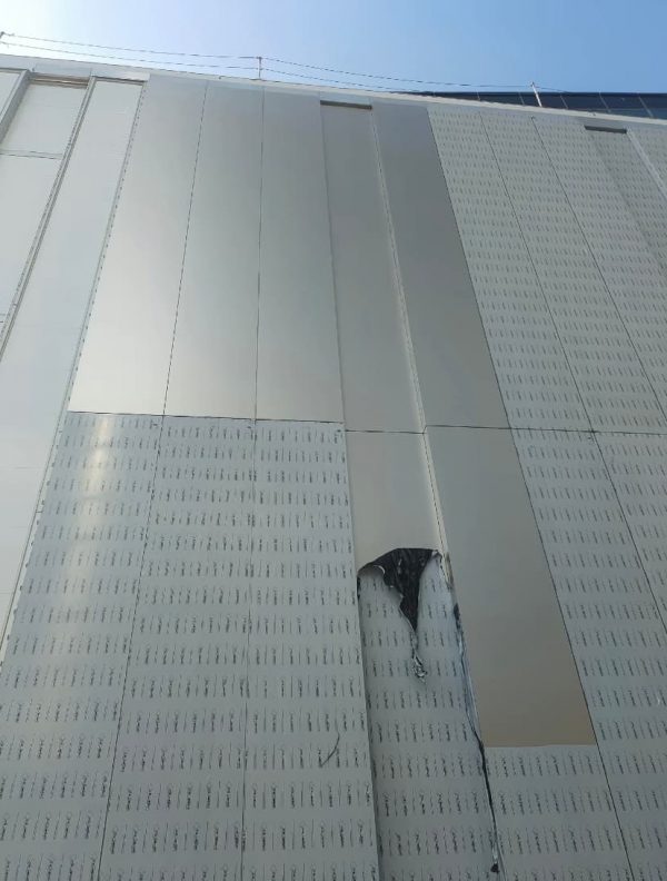Stainless steel metal curtain wall for large shopping mall by XinYe Metal, modern architectural facade.
