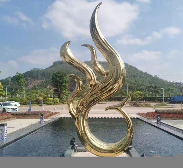 Minimalist stainless steel fountain feature with smooth arcs and gleaming surface
